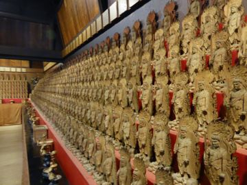 Room with multiple wood statues