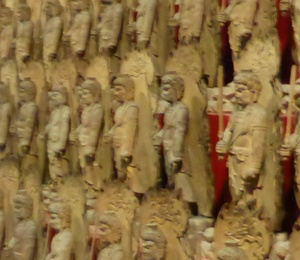 Room with multiple wood statues